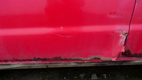 Slow panoramic shot, rust detail on old abandoned red car Stock Footage 258663286
