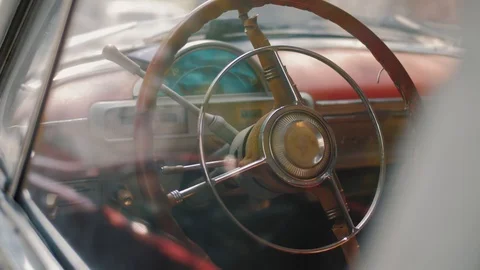 Slow panoramic shot of steering wheel of vintage retro car Stock Footage 119977501