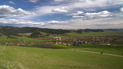 Slow panoramic shot from the top of a hill , small hungarian village Stock Footage 333640096