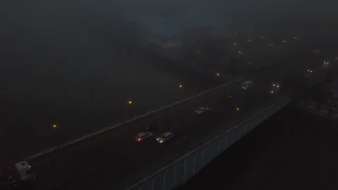 Slow Pass Over Bridge with Moving Traffic in Fog Stock Footage 103463042