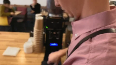 Slow. Process of making coffee. Closeup of hand holding a portafilter Stock Footage 123553186