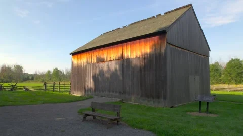 Slow Pull away Brigham Youngs barn shot near frame house for the Smith Family Stock Footage 293759210