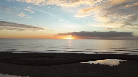 Slow pull away from sunset Stock Footage 320834261