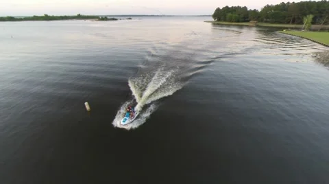 Slow pull back of jet ski on glassy lake Stock-Footage 50446736