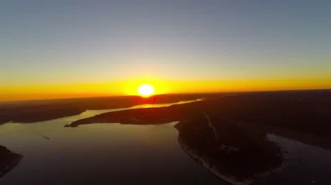 Slow pull back of sunset at the lake Stockbeeldmateriaal 46730638