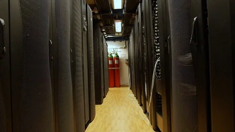 Slow pull back through rows of large computer serve towers in a server Stock Footage 97149160
