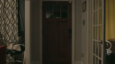 Slow pull from front door at night Stock Footage 168842790