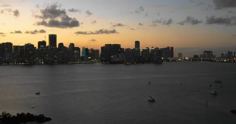 Slow Pull Out Aerial Above Little Island Revealing Brickell Coastline And Sunset Stock Footage 105422219