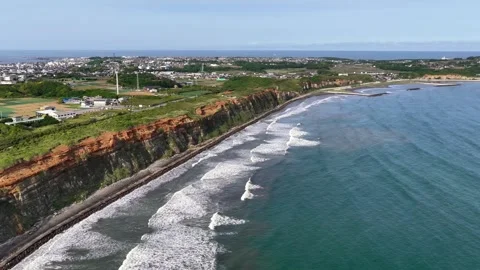 Slow Pullback Along Byobugaura Cliffs and Pacific Surf Stock Footage 342263757
