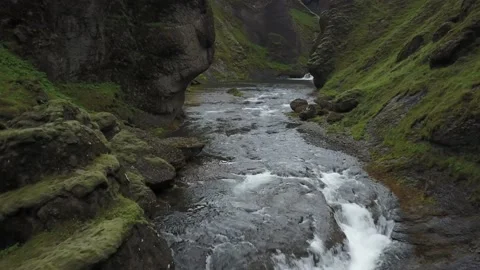 Slow push in aerial of small river in Iceland Stock Footage 166864112