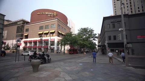 Slow push downtown Denver, Colorado through buildings and street Stock Footage 166187201