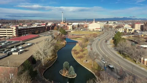 Slow push in drone shot of downtown Pueblo, Colorado Riverwalk Stock Footage 261485256