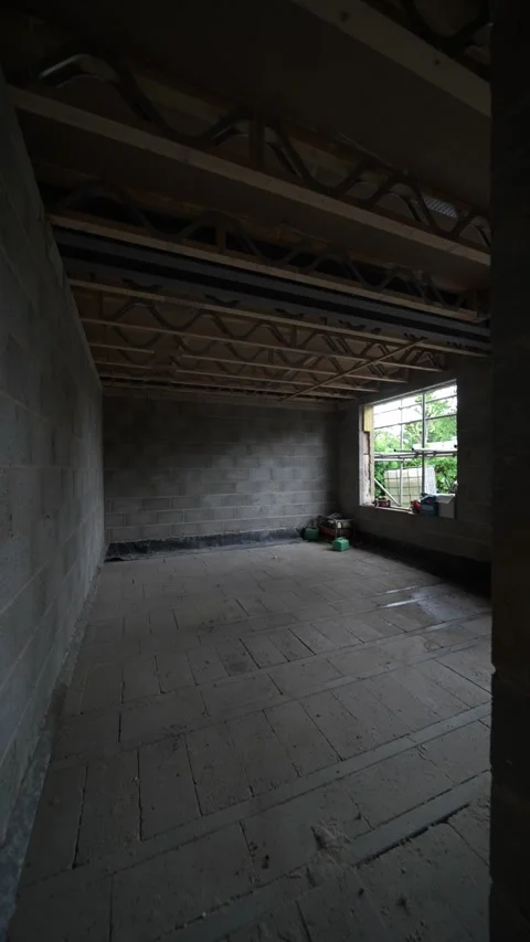 Slow Push into an Empty Room with Exposed Breeze Blocks in New Home Build Video stock 327427980