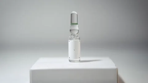 Slow Push-In on Glass Ampoule with Tracking Markers, Pharmaceutical Drug Concept Stock Footage 331696297