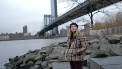 Slow push in on happy attractive young woman living city lifestyle NYC winter Stock Footage 121572301