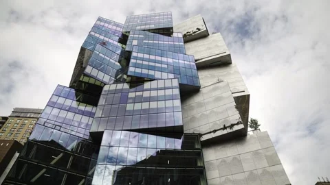 Slow push in of iconic Deloitte cubed shaped building made from off centered 스톡 동영상 300416845