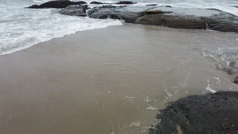 Slow Push out to Ocean Over Rocks Stock Footage 217407863