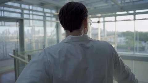 Slow push in - a science researcher or technician standing in a hospital or lab Stock Footage 112600948