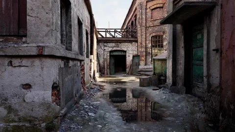 Slow Push Through Abandoned Factory Alley with Puddle Reflections Stock Footage 342107221