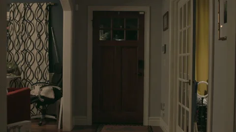 Slow push towards front door at night Stock Footage 168843023