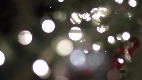Slow rack focus christmas lights to orniment Stock Footage 99584418