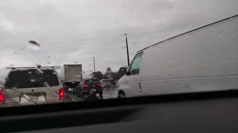 Slow rain traffic Stock Footage 68995002