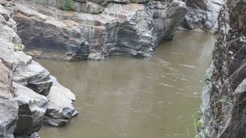 Slow reach in the rocky stream Stock Footage 94399321