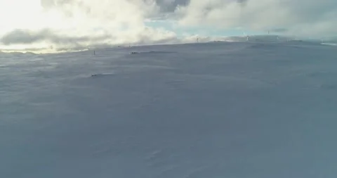 Slow reveal of winter wind power generation in the Arctic: Arial shot Stock Footage 152789723
