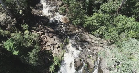 Slow reverse drone reveal of waterfall Stock Footage 97418267