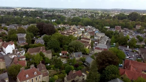 A slow reverse flight over the Somerset town of Frome revealing Catherine Hill Stock Footage 343693661