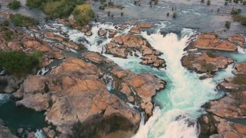 Slow reverse travelling of Li Phi Somphamit Waterfalls at sunset. Don Det, Laos. Stock Footage 246939951