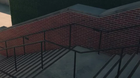 Slow right to left pan across brick staircase and concrete landing with railings Stock Footage 332630084