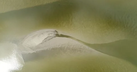 Slow rising of a drone above a shallow river Stock Footage 132998142