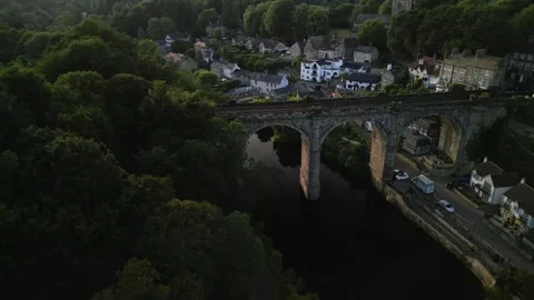 Slow rising pivot with drone to show the Knaresborough stone viaduct bridge Stock-Footage 321440233