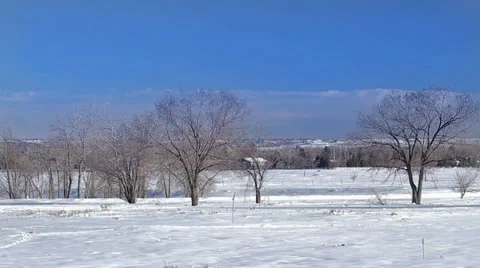 Slow Rolling Clouds and Snowy Field Timelapse 스톡 동영상 30559431