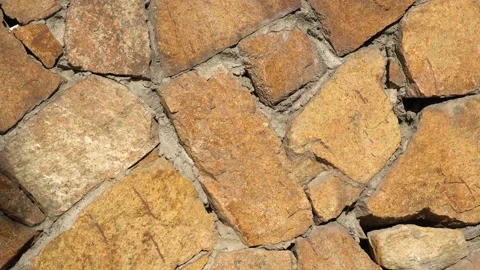 Slow rotate movement stone wall close-up. Slowly spin moving masonry closeup 4k. Stock Footage 98121382