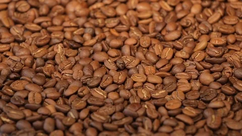 Slow rotation of the heap of coffee beans. Close up of coffee beans. Loopable Stock Footage 75826569