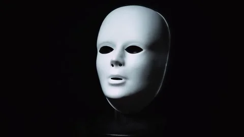 Slow rotation of the white mask in front of a black background. Stock Footage 309598459