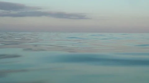 Slow Sea of Mallorca with sunset reflections Stock Footage