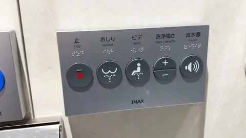 Slow shot of the control panels within the modern toilets in Osaka Train Stock Footage 250581181