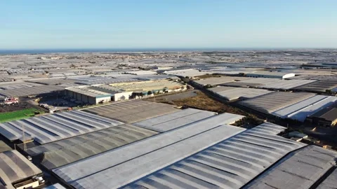 Slow shot of drone ascending over greenhouses in Almeria, Andalusia, Spain Stock Footage 218586534