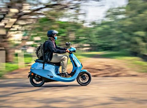 Slow shutter, Motion blur image of a rider wearing helmet for safety, riding  Stock Photos