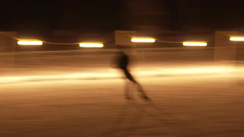 Slow shutter shot of night pond hockey skaters Stock Footage 147404931