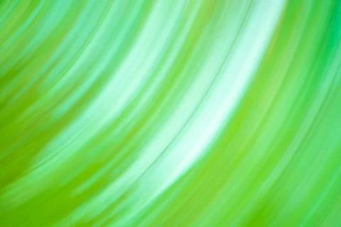 Slow shutter speed with motion green blur effect. Decorative green backdrop f Stock Photos