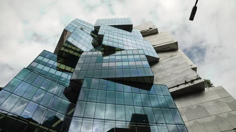 Slow side to side parallax around off centered cube stacked building in Stock Footage 300416961