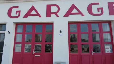 Slow side tracking shot from modern Garage Gallery Stock Footage 160936452