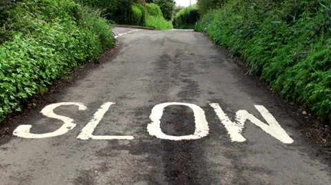 SLOW SIGN ON ROAD Stock Footage 37321305