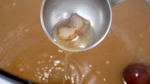 Slow-Simmered Bone Broth: Rich Home Kitchen Process and Long Simmer Stock Footage 344031947