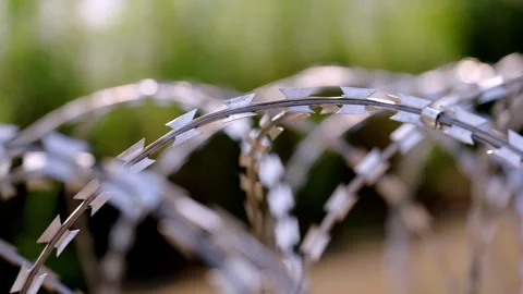 Slow Slide Along Sharp Concertina Razor Wire, Shallow Focus Stock-Footage 344122500