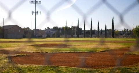 Slow slide left looking out on an empty green baseball field diamond from Stock Footage 97495704